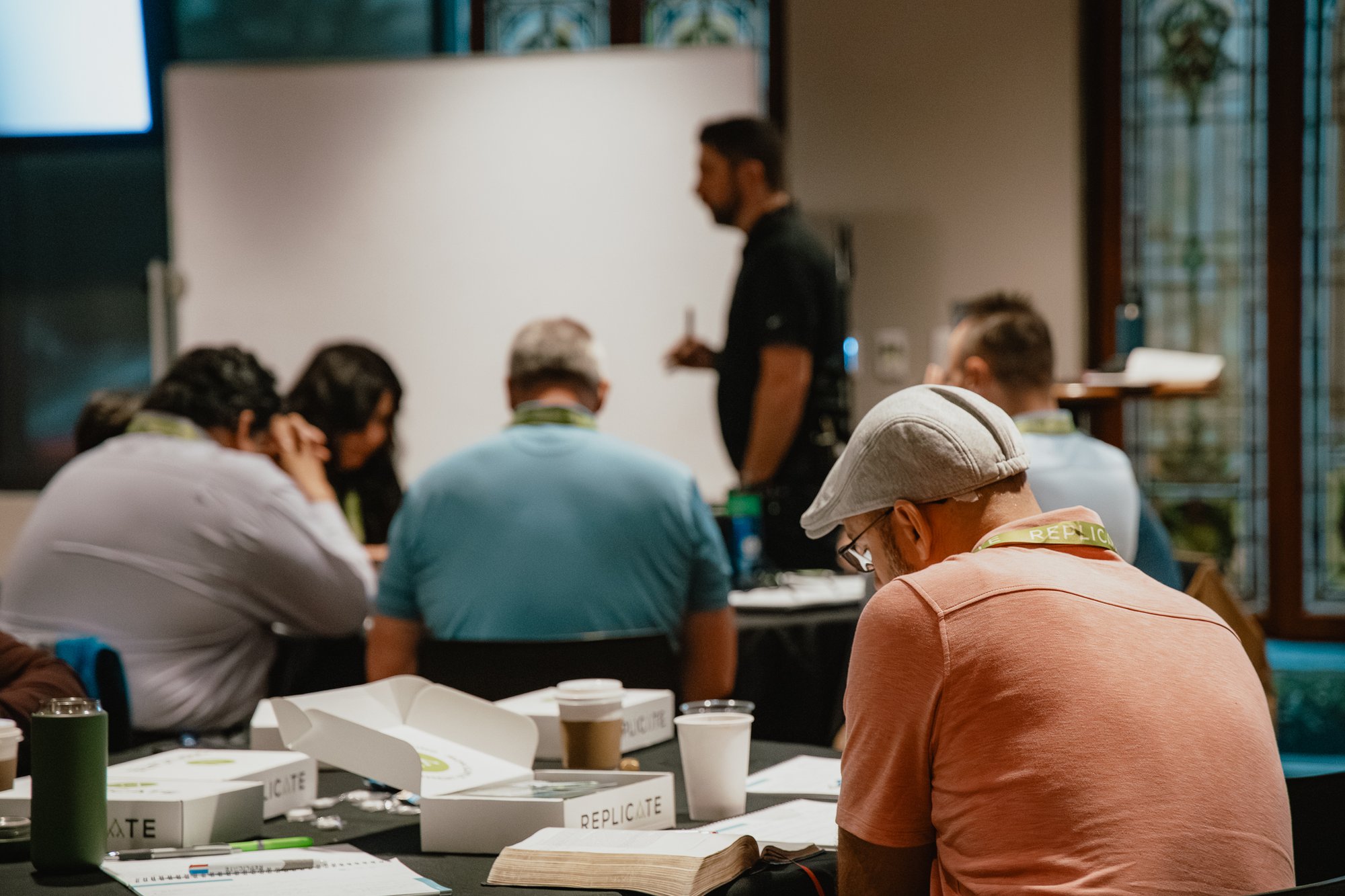 brad teaching with person focused at table
